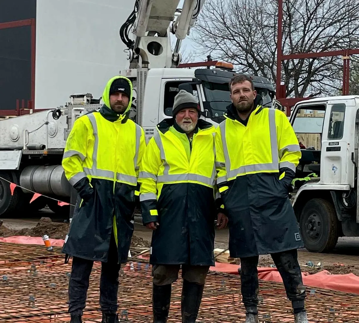Adelaide Custom Concrete crew placing and finishing a concrete pour